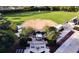Aerial view of a baseball field with manicured grounds, a monument, and manicured landscaping surrounding the area at 9017 Se 119Th St, Summerfield, FL 34491