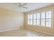 Bright bedroom with shutters on the window and hardwood floors at 9017 Se 119Th St, Summerfield, FL 34491