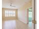 Bright bedroom with wide window and door to screened porch at 9017 Se 119Th St, Summerfield, FL 34491