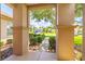 View from front porch showing manicured bushes lining the sidewalk in a well-kept neighborhood at 9017 Se 119Th St, Summerfield, FL 34491
