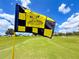 Eagle Ridge Golf Club flag on a sunny day, showcasing a well-maintained green and blue skies at 9017 Se 119Th St, Summerfield, FL 34491