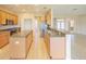 Spacious kitchen with an island, stainless steel appliances, and hardwood floors at 9017 Se 119Th St, Summerfield, FL 34491