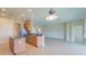 Spacious kitchen with an island, stainless steel appliances, and hardwood floors at 9017 Se 119Th St, Summerfield, FL 34491