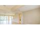 Spacious and bright living room with wood-look floors and large windows for natural light at 9017 Se 119Th St, Summerfield, FL 34491
