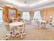 Inviting lounge area with comfortable seating, large windows, and elegant decor providing a relaxing atmosphere at 9017 Se 119Th St, Summerfield, FL 34491