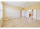 Spacious main bedroom featuring wood-look floors, a ceiling fan, and ample natural light at 9017 Se 119Th St, Summerfield, FL 34491
