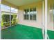 Open porch area with nice shrubbery, and a bright window at 9017 Se 119Th St, Summerfield, FL 34491