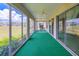 Screened lanai with room to relax and enjoy views of the green backyard at 9017 Se 119Th St, Summerfield, FL 34491
