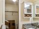 Bathroom vanity with granite countertop, mirrored medicine cabinet and closet at 925 Fenton Ln # 18, Lakeland, FL 33809