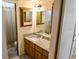 This bathroom features a granite countertop, sink, and a shower at 925 Fenton Ln # 18, Lakeland, FL 33809