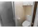 Cozy bathroom featuring a shower and toilet with overhead storage cabinet at 925 Fenton Ln # 18, Lakeland, FL 33809