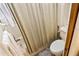 This bathroom features a shower, toilet, and tiled shower walls at 925 Fenton Ln # 18, Lakeland, FL 33809