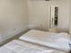 Bedroom featuring two twin beds, light carpet, and closet space at 925 Fenton Ln # 18, Lakeland, FL 33809