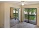 This bedroom features a sliding glass door and a mirrored closet sliding door at 925 Fenton Ln # 18, Lakeland, FL 33809