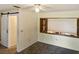 This bedroom features a sliding barn door and window with blinds at 925 Fenton Ln # 18, Lakeland, FL 33809
