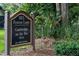 Community sign for 925 Fenton Lane, Cambridge on the Tee HOA surrounded by greenery at 925 Fenton Ln # 18, Lakeland, FL 33809
