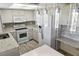 Modern kitchen with white cabinets, granite countertops, an island, and stainless appliances at 925 Fenton Ln # 18, Lakeland, FL 33809