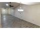 Spacious living room features wood-look floors, a chandelier, and large mirrored wall at 925 Fenton Ln # 18, Lakeland, FL 33809