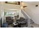 Cozy living room with stylish furniture and a staircase adds charm to the space at 925 Fenton Ln # 18, Lakeland, FL 33809