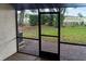 Screened patio offering serene views of the home's lawn and landscape, offering privacy and relaxation at 925 Fenton Ln # 18, Lakeland, FL 33809