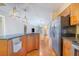 Modern kitchen featuring stainless steel appliances, granite countertops, and wood cabinetry at 1523 Mariner Rd, Lakeland, FL 33803