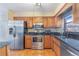 Traditional kitchen with stainless steel appliances and wooden cabinets at 1523 Mariner Rd, Lakeland, FL 33803