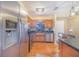 Modern kitchen featuring stainless steel appliances, granite countertops, and wood cabinetry at 1523 Mariner Rd, Lakeland, FL 33803