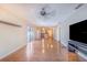Spacious living room featuring sliding glass doors and wood-look flooring at 1523 Mariner Rd, Lakeland, FL 33803