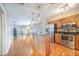 Open floor plan connecting kitchen and living area with wood-look flooring at 1523 Mariner Rd, Lakeland, FL 33803