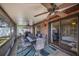 Relaxing screened patio featuring ceiling fans, tile flooring and views of the backyard through sliding glass doors at 1523 Mariner Rd, Lakeland, FL 33803