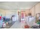 Spacious utility room with washer, dryer and storage shelving at 1523 Mariner Rd, Lakeland, FL 33803