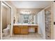 Bathroom boasts a single sink vanity, a large mirror, and a shower with subway tile at 1081 Sunshine Sw Way, Winter Haven, FL 33880
