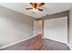 Bedroom features wood laminate floors, neutral paint, and ample closet space at 1081 Sunshine Sw Way, Winter Haven, FL 33880