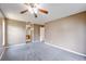 Carpeted bedroom features a neutral color scheme, a ceiling fan and lots of natural light at 1081 Sunshine Sw Way, Winter Haven, FL 33880