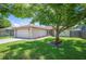 Charming single-story home with a well-manicured lawn, mature tree, and an attached two-car garage at 1081 Sunshine Sw Way, Winter Haven, FL 33880