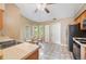 Eat-in kitchen area showcasing a tile floor, bay windows, and a dining set at 1081 Sunshine Sw Way, Winter Haven, FL 33880