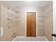 Practical laundry room with shelving and a utility sink, offering convenience and storage space at 1081 Sunshine Sw Way, Winter Haven, FL 33880
