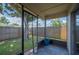 The screened porch offers an unobstructed view of the backyard through its screen at 1081 Sunshine Sw Way, Winter Haven, FL 33880
