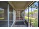 Relaxing screened porch with backyard views, perfect for enjoying the outdoors in comfort at 1081 Sunshine Sw Way, Winter Haven, FL 33880