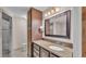 Bathroom featuring granite counters and bronze fixtures at 113 W Juliana Way, Auburndale, FL 33823