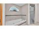 Relaxing bathroom featuring a separate tub and tiled shower at 113 W Juliana Way, Auburndale, FL 33823