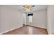 Bedroom featuring wood laminate flooring, a ceiling fan, and window for lots of natural light at 113 W Juliana Way, Auburndale, FL 33823