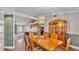 Open concept dining room with a classic wooden table, chairs, and view to the kitchen area at 113 W Juliana Way, Auburndale, FL 33823