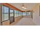 Bright Florida room with tile flooring and multiple windows at 113 W Juliana Way, Auburndale, FL 33823