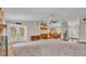 Expansive living room showcasing an open floor plan with views of the dining area, kitchen, and entryway at 113 W Juliana Way, Auburndale, FL 33823