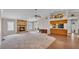 Spacious living room with a stone fireplace, ceiling fan, and an open layout for modern living at 113 W Juliana Way, Auburndale, FL 33823