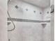 Tiled shower featuring decorative accents, built-in shelves, and a handheld shower head fixture at 113 W Juliana Way, Auburndale, FL 33823