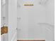 Walk-in closet with installed metal shelving, a wood floor and a hanging rack with hooks at 113 W Juliana Way, Auburndale, FL 33823