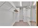 Walk-in closet featuring custom shelving and ample storage space at 113 W Juliana Way, Auburndale, FL 33823