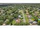 Charming neighborhood view with lush landscaping and well-maintained homes with pools at 1210 Heidi S Ln, Lakeland, FL 33813